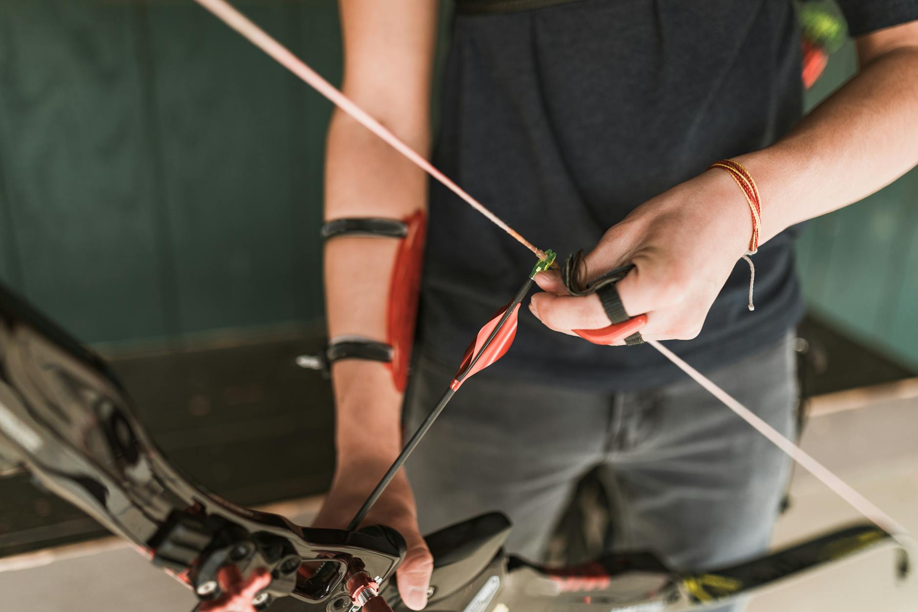 man holding a recurve bow